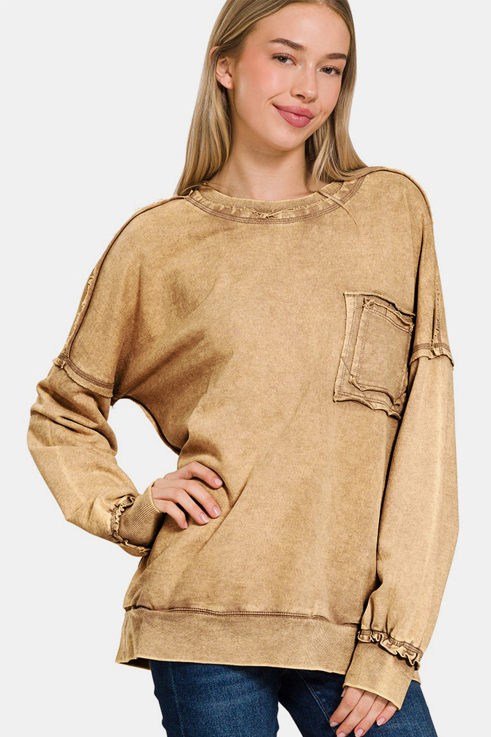 Exposed seam round neck sweatshirt with dropped shoulders in soft cotton, featuring trendy deconstructed style and relaxed fit.