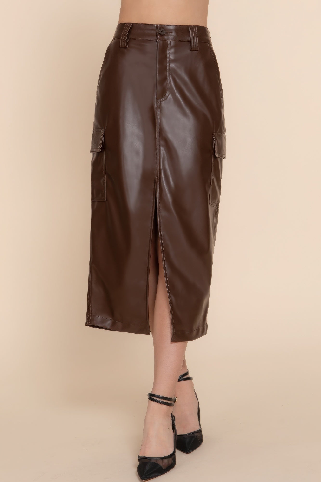 Sleek faux leather midi cargo skirt in brown with front slit, versatile and stylish for any occasion, available in sizes S, M, L.