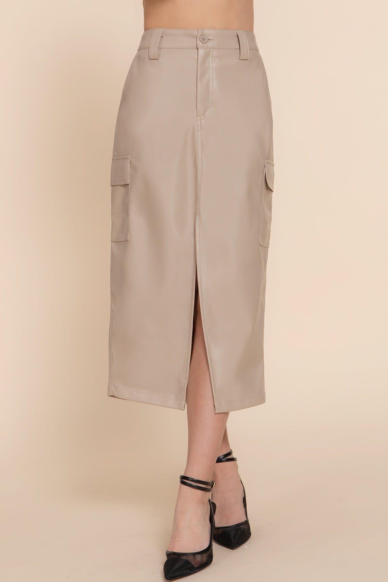 Beige faux leather midi cargo skirt with pockets, regular fit, front slit, versatile trendy style, perfect for any occasion.