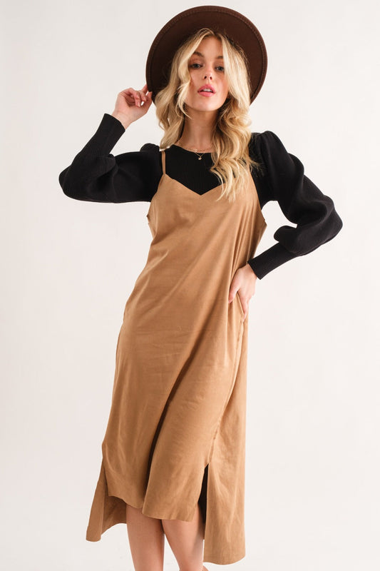 Woman wearing Faux Suede Cut Edge Slit Cami Midi Dress, featuring a high-low hem and slight stretch in a tan color.