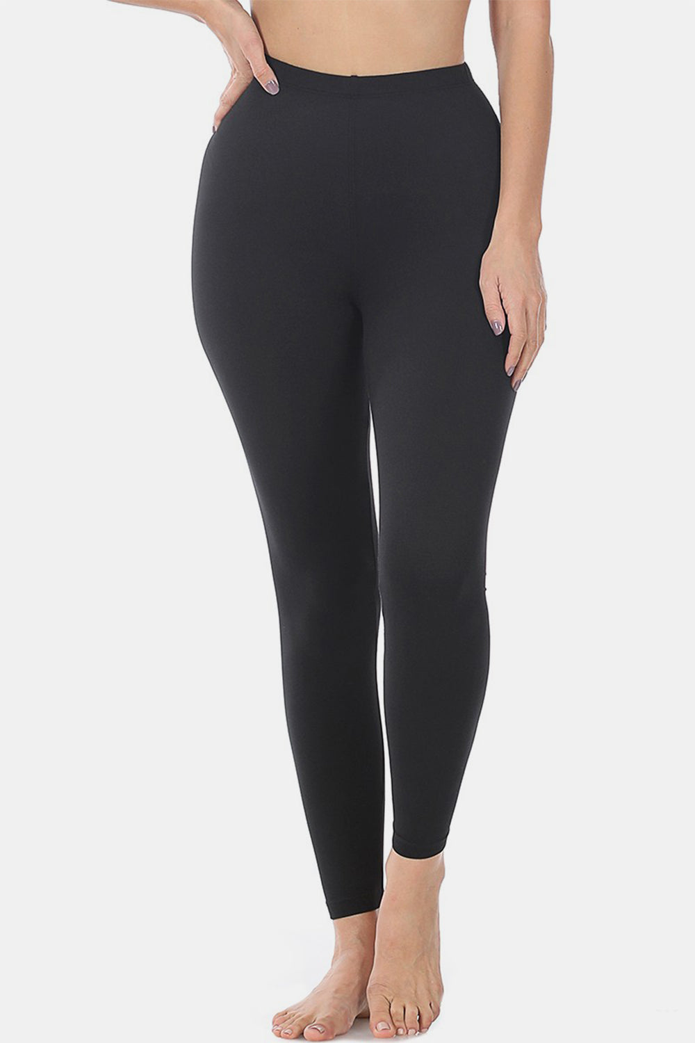 Premium microfiber high-waisted leggings in black, elongating legs with a sleek, opaque look and comfortable moderate stretch.