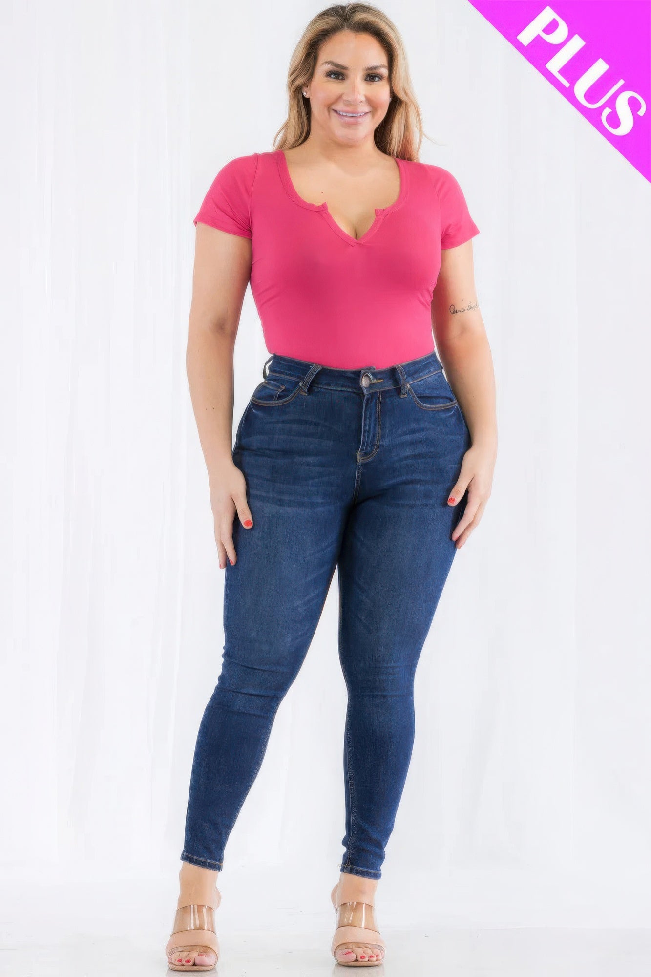 Plus size casual split neck short sleeve bodysuit in vibrant Poinciana color, styled with jeans for a trendy and comfortable look.