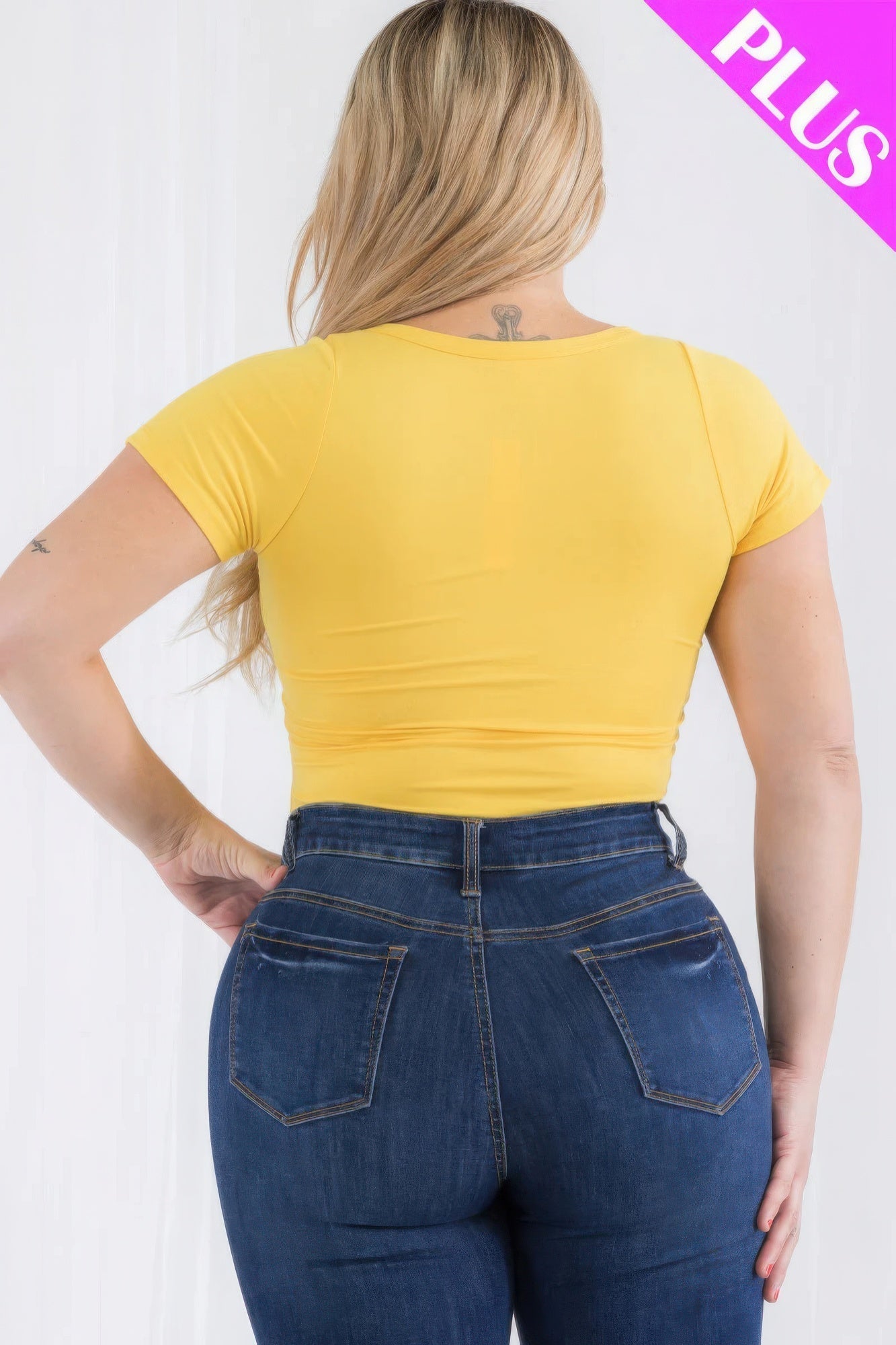 Plus size casual split neck bodysuit in vibrant Poinciana, back view on model, showcases flattering fit and soft, stretchy material.