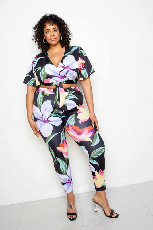 Plus-size model wearing Flower Jogger & Top Set in Multi/Black with floral pattern, showcasing 1XL to 3XL sizing options.