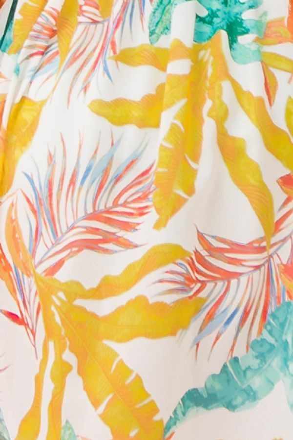 Colorful tropical print on ivory woven fabric for maxi cover up with vibrant leaves and floral patterns.