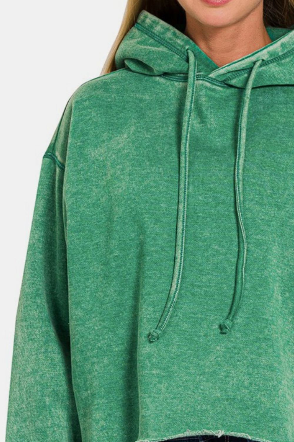 Green acid wash fleece cropped hoodie with drawstrings and cozy fit.