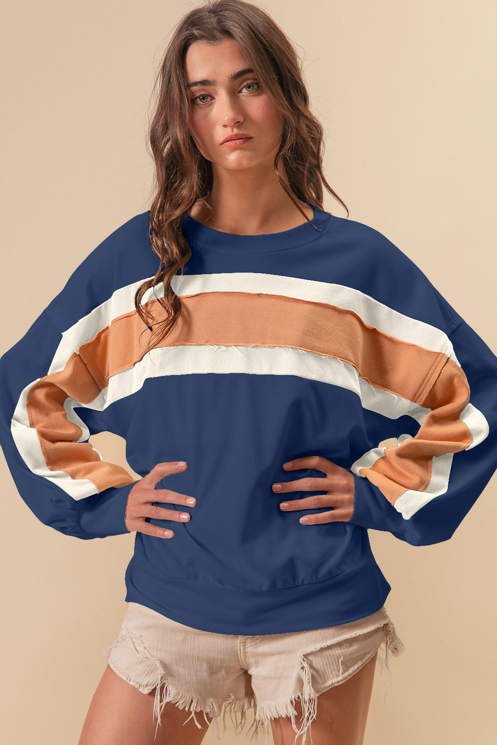 Woman wearing French Terry Color Block Sweatshirt with cut edge detail, showcasing the versatile style and polished look.