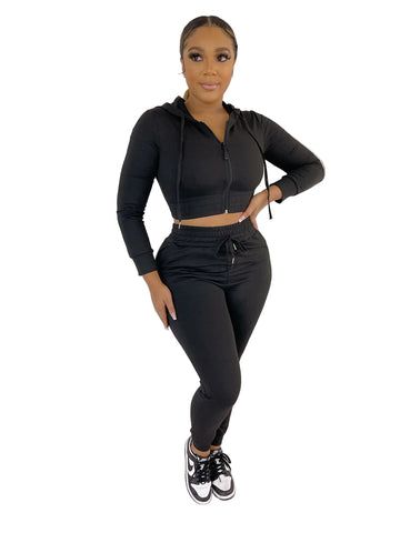 Woman wearing a black French Terry Jacket & Pants Set made of 92% polyester and 8% spandex, perfect for casual wear.