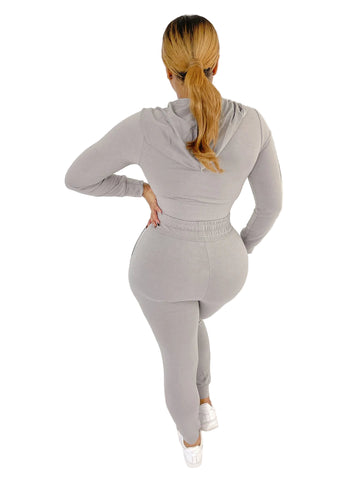 Woman wearing gray French Terry Jacket & Pants Set made of polyester and spandex, showcasing a stylish and comfortable fit.