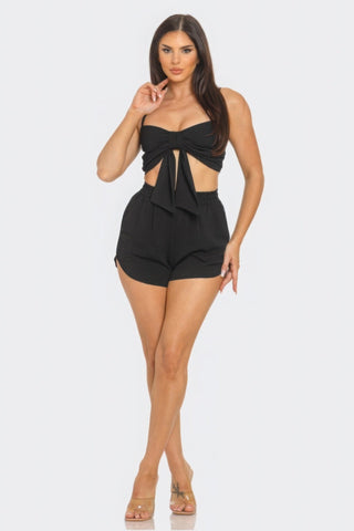 Chic black oversized tie top and shorts set with front bow, perfect for versatile occasions and comfortable all-day wear.
