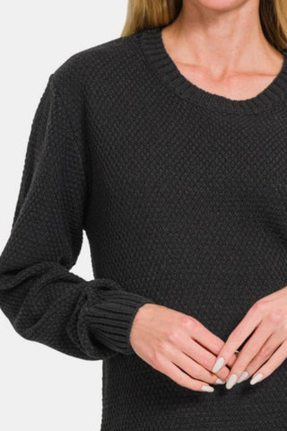Full size round neck long sleeve sweater in dark color with curved hem, slightly stretchy acrylic material.