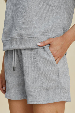 Women's texture short sleeve top and shorts set with pockets and drawstring, gray, slightly stretchy, 98% polyester, 2% elastane.