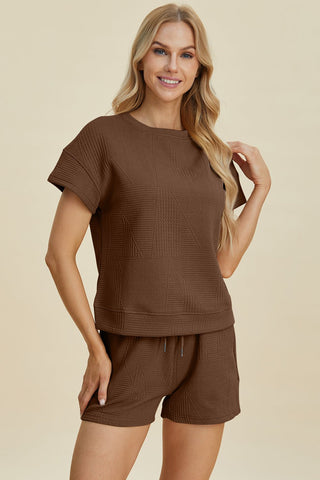 Woman wearing brown full-size texture short sleeve top and shorts set, pocketed, featuring a drawstring, made of polyester and elastane.