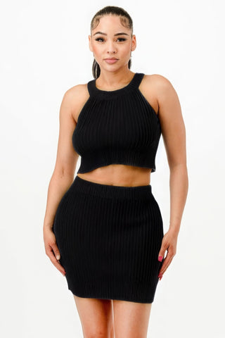 Woman wearing chic black halter neck tank top and bodycon mini skirt set, perfect for parties and casual-chic events.