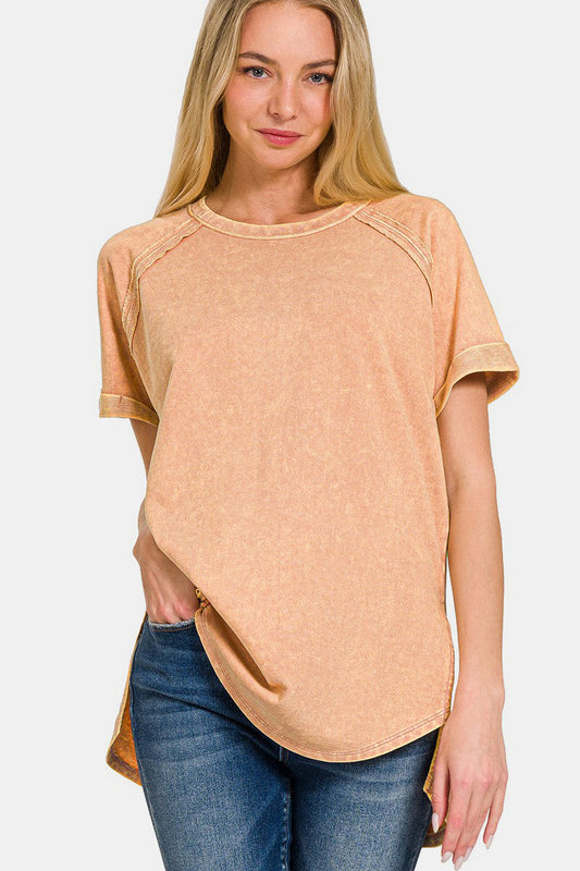 Woman wearing a heathered round neck short sleeve top with moderate stretch in 100% cotton, paired with jeans.