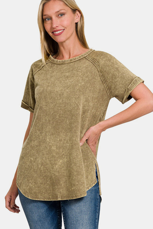 Woman wearing heathered round neck short sleeve top, 100% cotton, moderate stretch, basic style, paired with jeans.