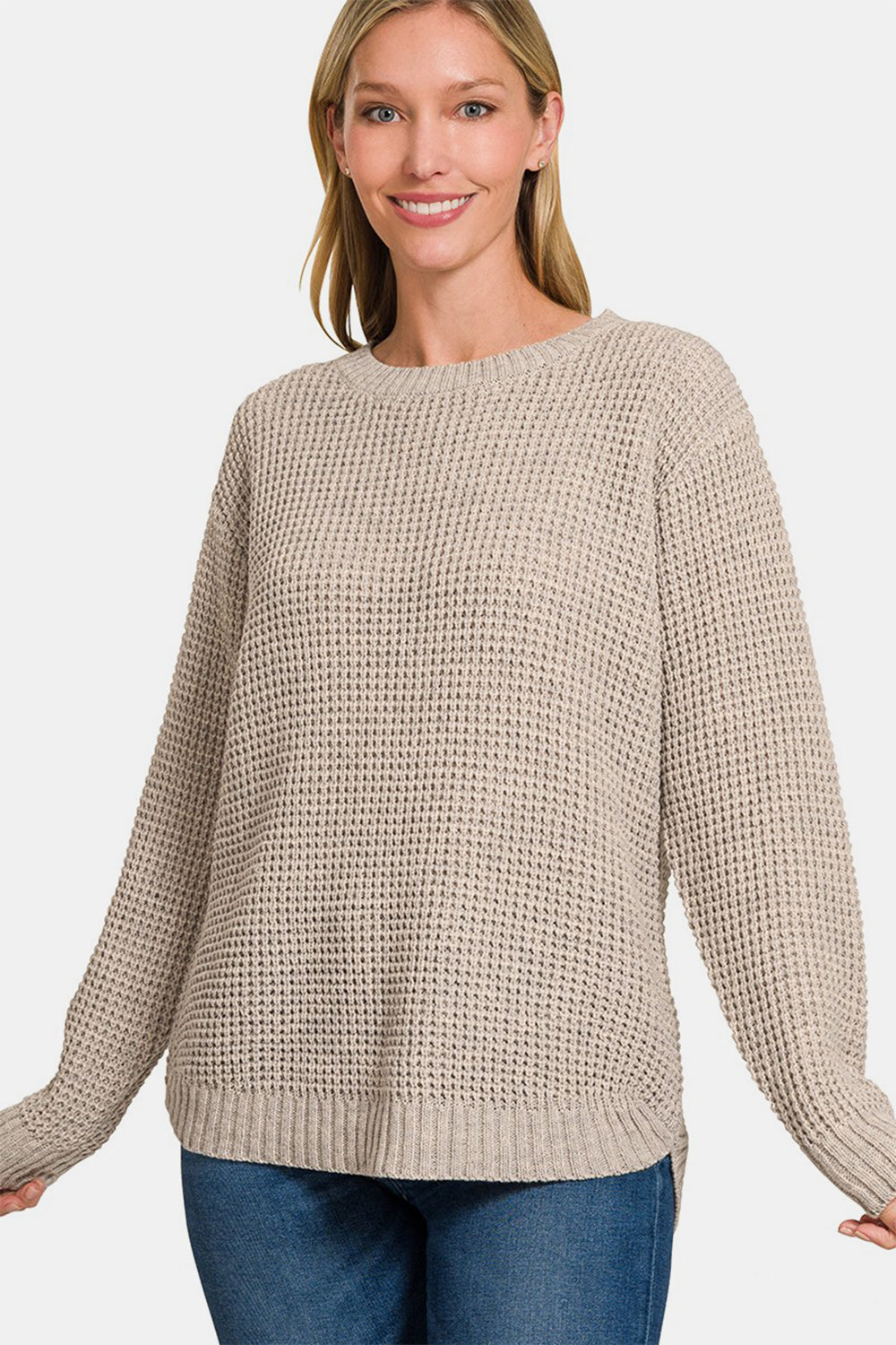 High low long sleeve waffle sweater in beige, featuring a moderate stretch and waffle-knit design, made from 100% acrylic material.