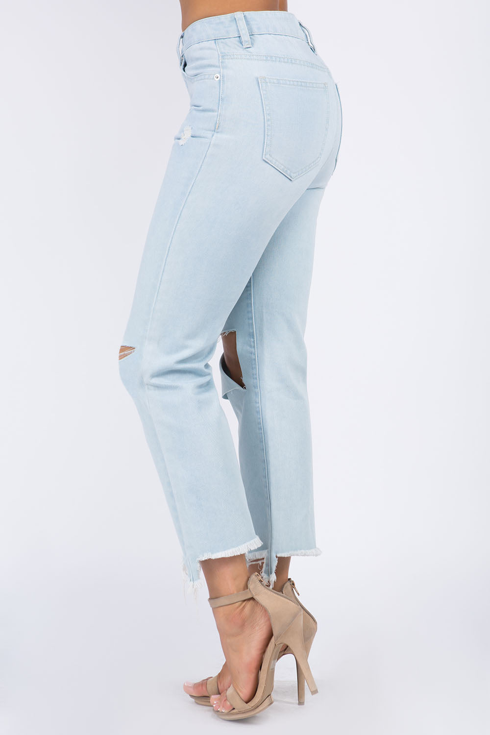 High Waist Distressed Raw Hem Jeans in light blue denim with trendy raw edges and functional pockets for a chic, casual style.