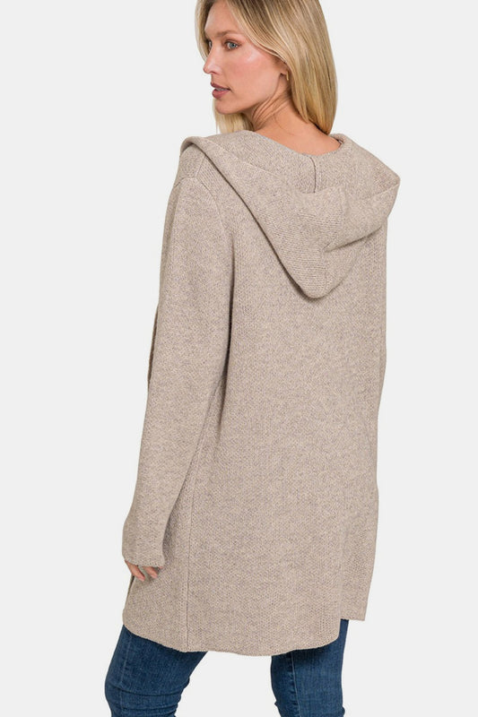 Woman wearing a cozy hooded open front sweater cardigan with front pockets, perfect for layering with casual outfits.