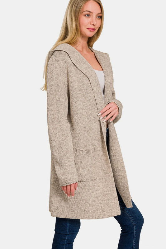 Woman wearing a beige hooded open front sweater cardigan with front pockets, perfect for casual layering or lounging, soft and cozy fabric.