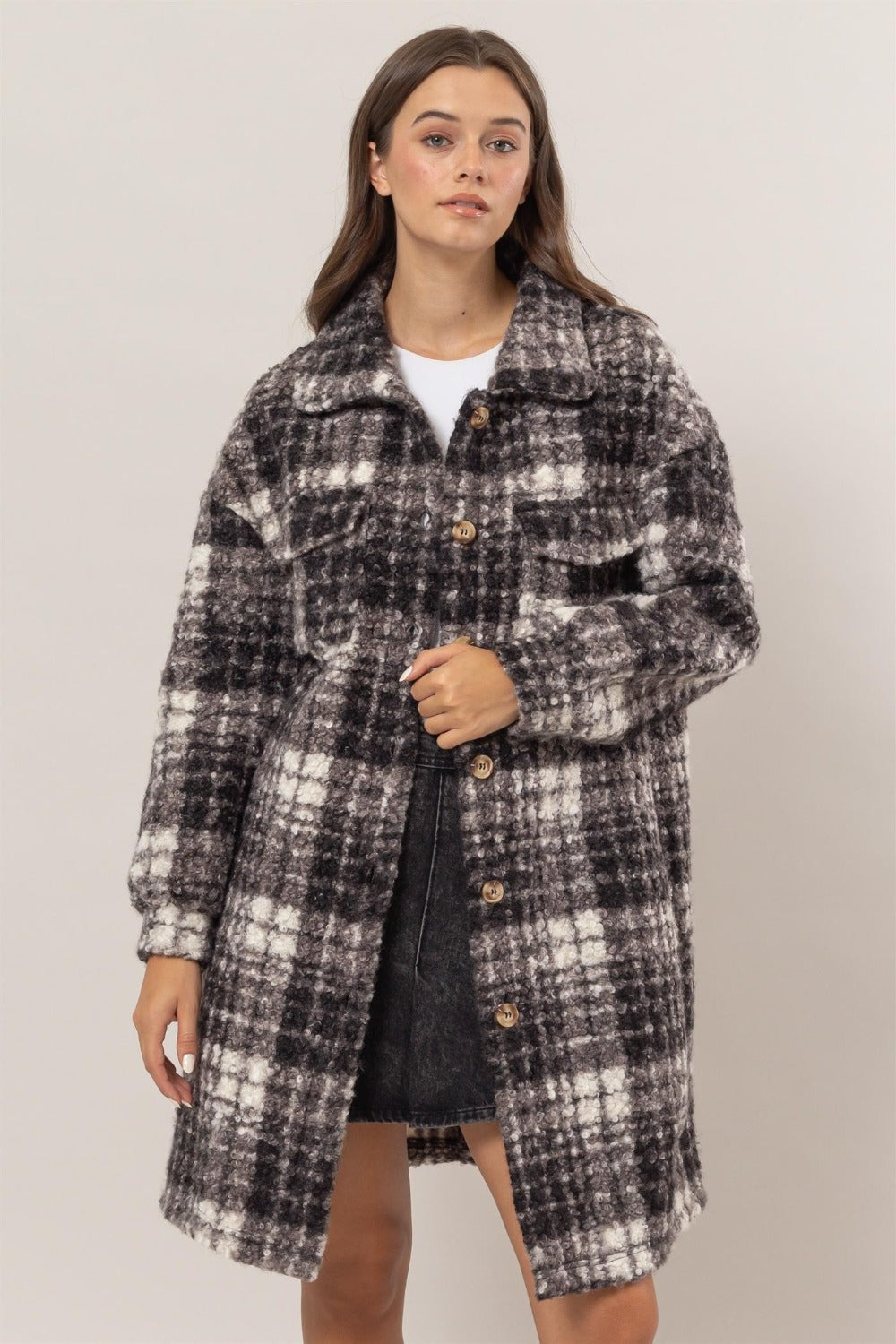 Woman wearing HYFVE plaid bouclé shacket with button-front bodice and chest flap pockets, showcasing stylish longline design.