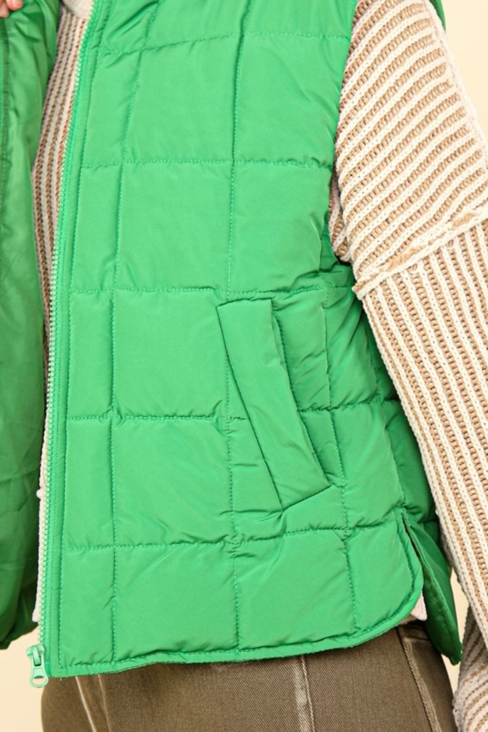 Women's Kelly Green quilted puffer vest with zip-up closure and plush lining, perfect for winter layering and cold weather comfort.