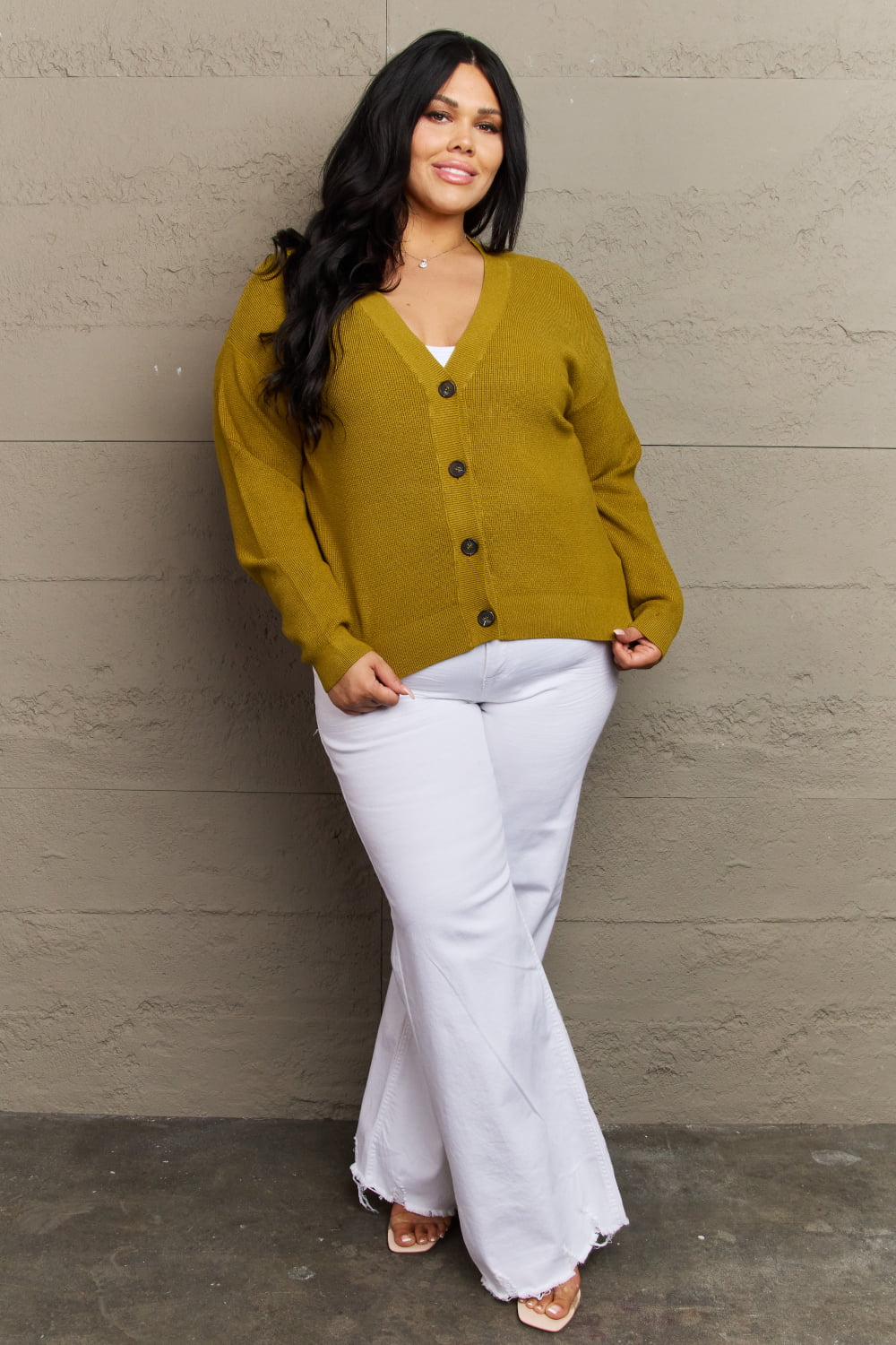 Chartreuse Kiss Me Tonight cardigan with V-neck and button-down style, paired with white pants, showcasing a casual, ribbed design.