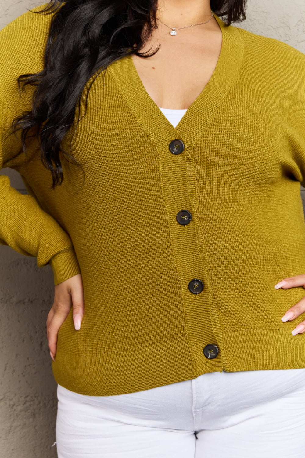 Chartreuse button-down cardigan with V-neck and long sleeves, ribbed texture, highly stretchy material blend for casual style.