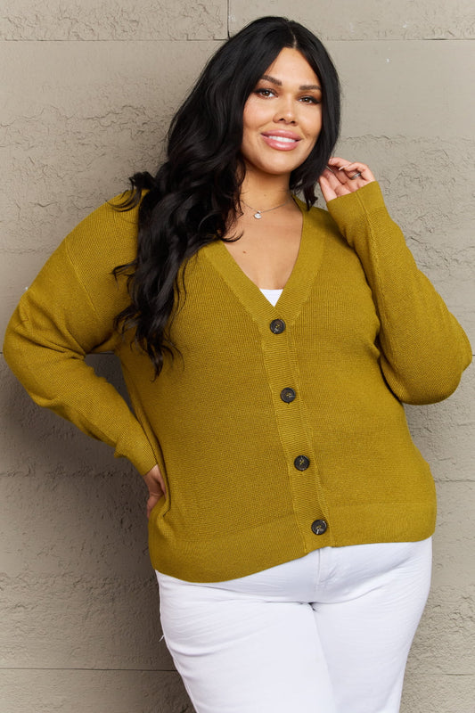 Woman wearing Kiss Me Tonight Full Size Cardigan in chartreuse with button-down style and long sleeves, showcasing casual elegance.