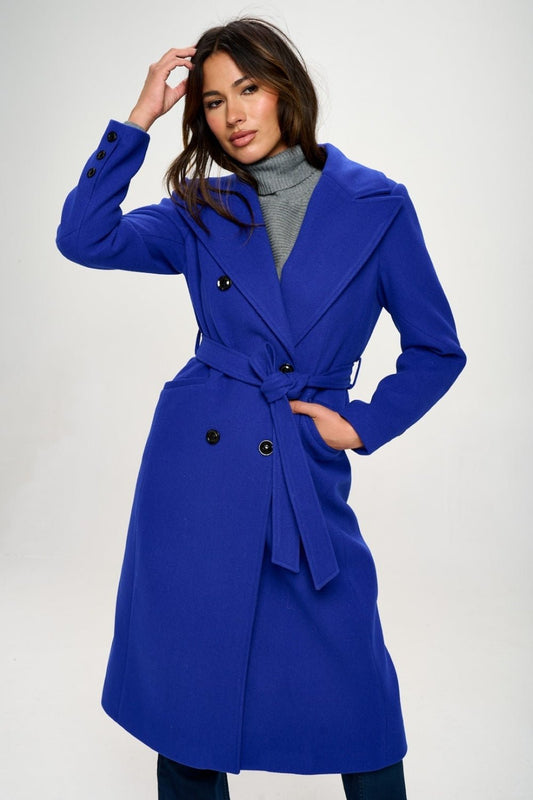 Woman wearing LA Double-Breasted Longline Belted Coat in Royal Blue, showcasing elegant design and vegan wool material.