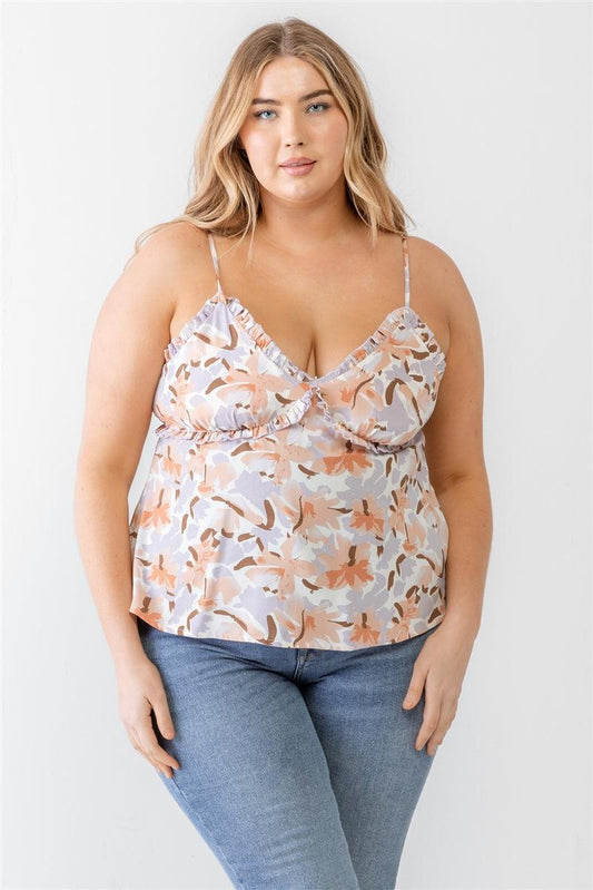 Plus size model wearing a floral print lavender woven tank top with ruffles, v-neckline, and adjustable straps.