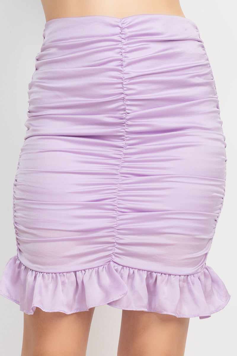 Lavender mini skirt with ruching, high waist, back smocking, and ruffled hem in a stylish polyester fabric.