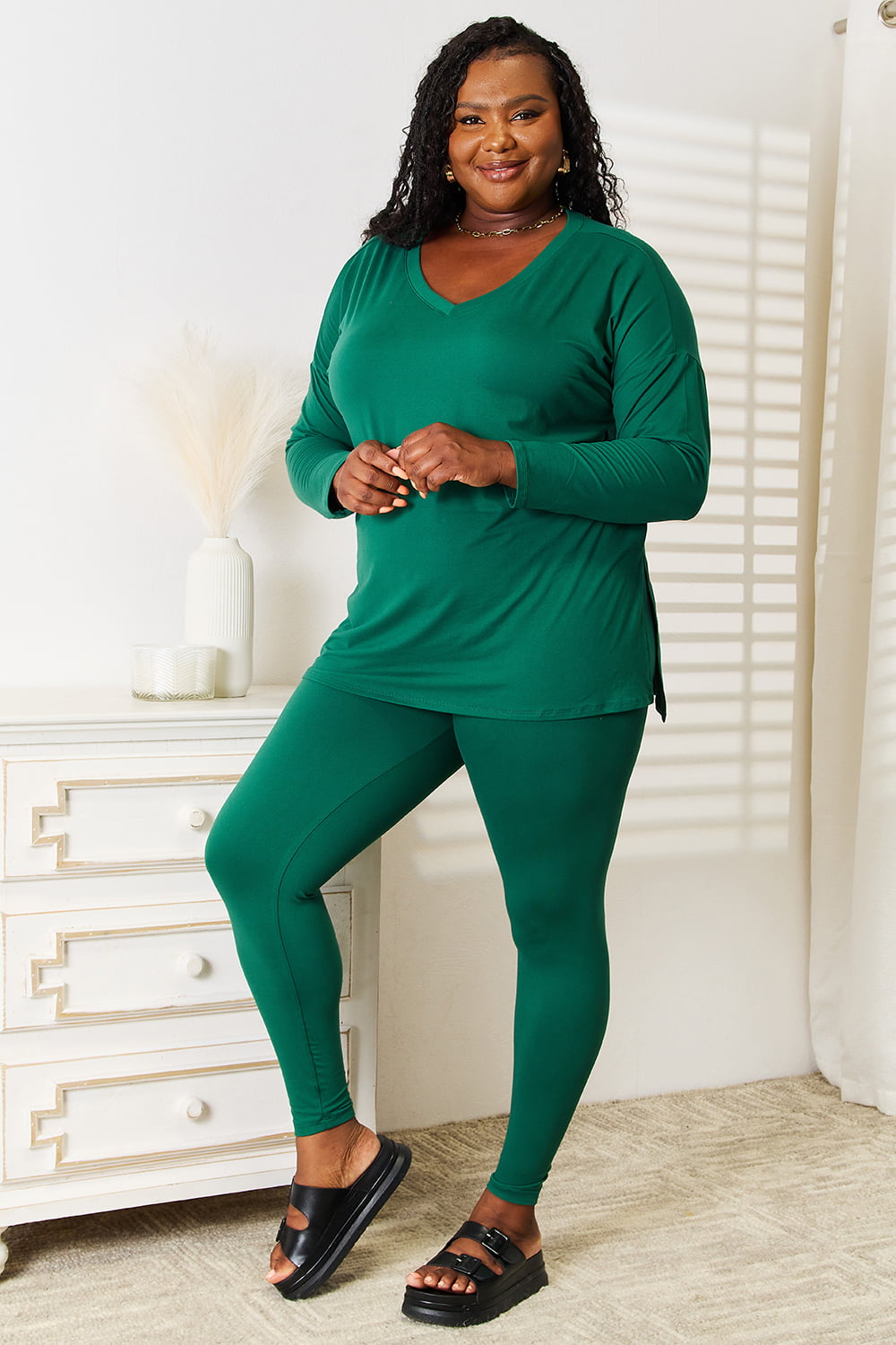 Woman wearing a green Lazy Days full-size long sleeve top and leggings set, basic style, made of 90% polyester and 10% spandex.