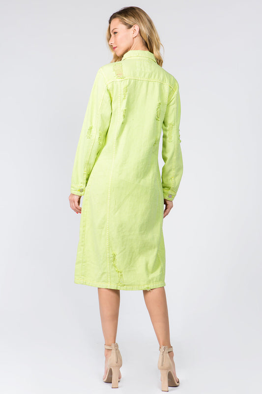 Woman wearing lime button-up distressed denim dress made of 100% cotton, shown from the back with long sleeves and no stretch.