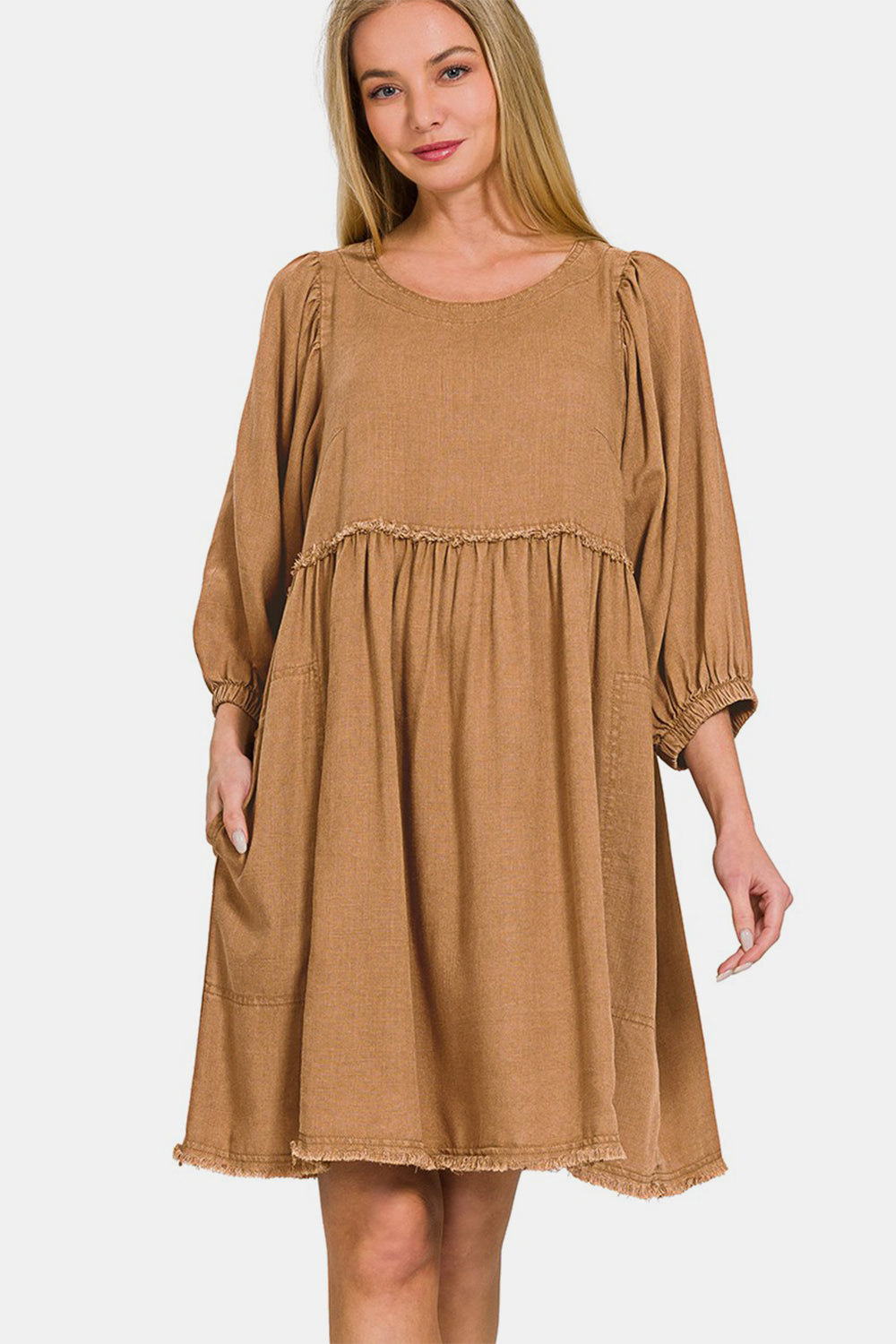 Linen pleated puff sleeve babydoll dress with ruched details and pockets, made from 25% linen, 75% rayon.