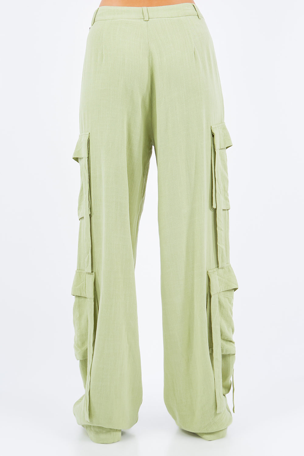 Light green linen wide leg cargo pants with side pockets, perfect for versatile and stylish fashion-forward outfits.