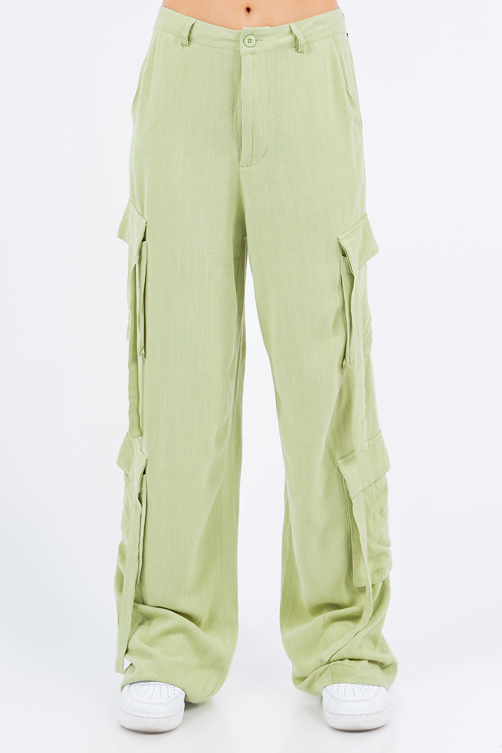 Light green linen wide leg cargo pants, breathable rayon blend, showcasing timeless style and comfort for versatile fashion.