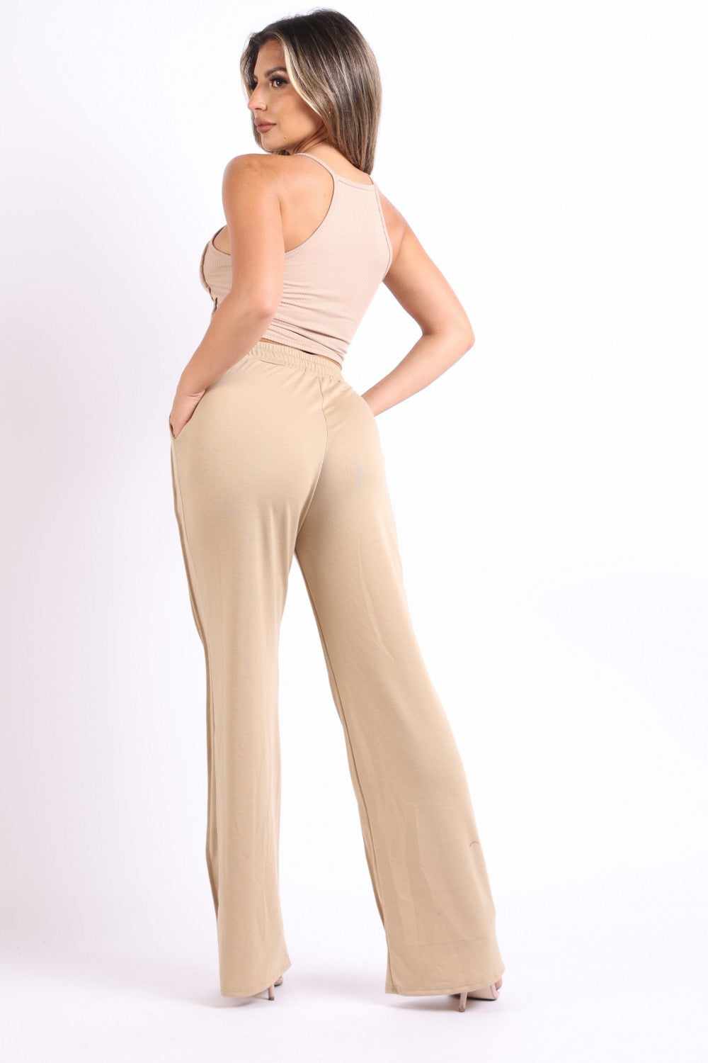 Woman modeling mocha pin tuck detailed lounge set with tank top and wide-leg pants. Comfortable and stylish outfit for casual wear.