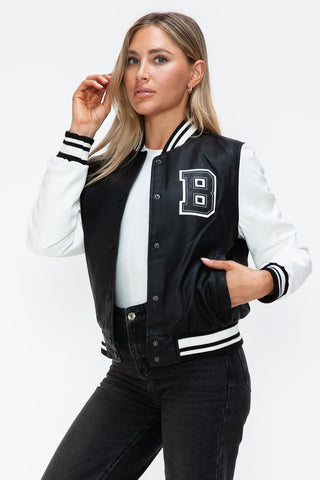 Woman wearing a Love PU Leather Contrast Snap Down Bomber Jacket with black and white design.
