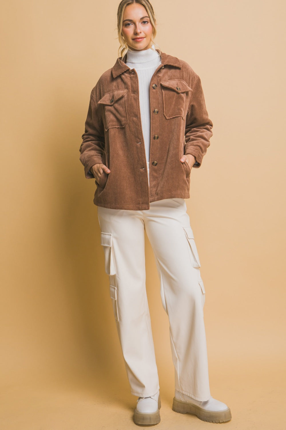 Woman wearing Love Tree Corduroy Button Up Jacket with Sherpa Inside, showcasing style and warmth with button-up design and cozy lining.