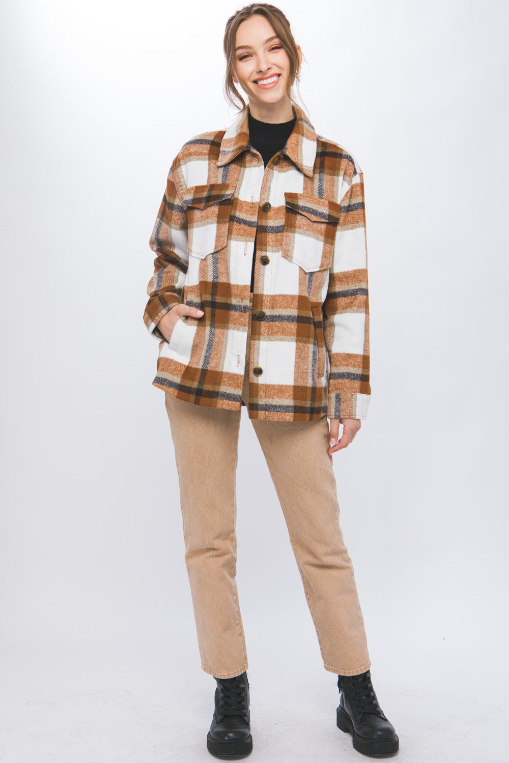 Woman modeling Love Tree Plaid Button Up Shacket, showcasing chic casual style and classic plaid design with pocket details.