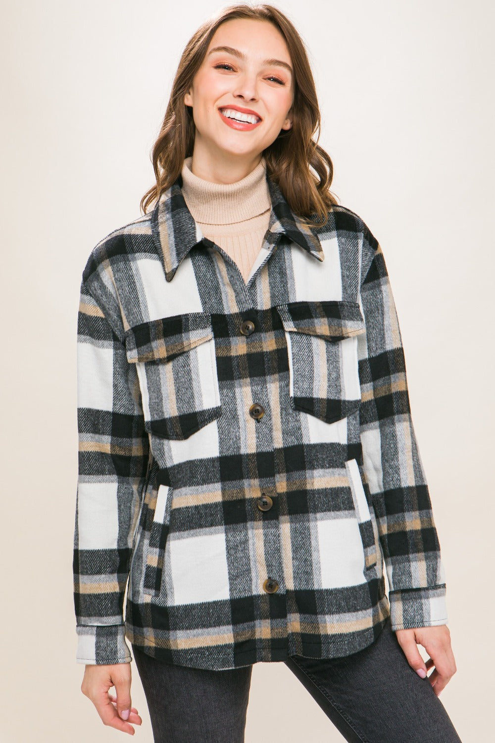 Woman wearing Love Tree Plaid Button Up Shacket, featuring classic plaid pattern for versatile and chic casual style.