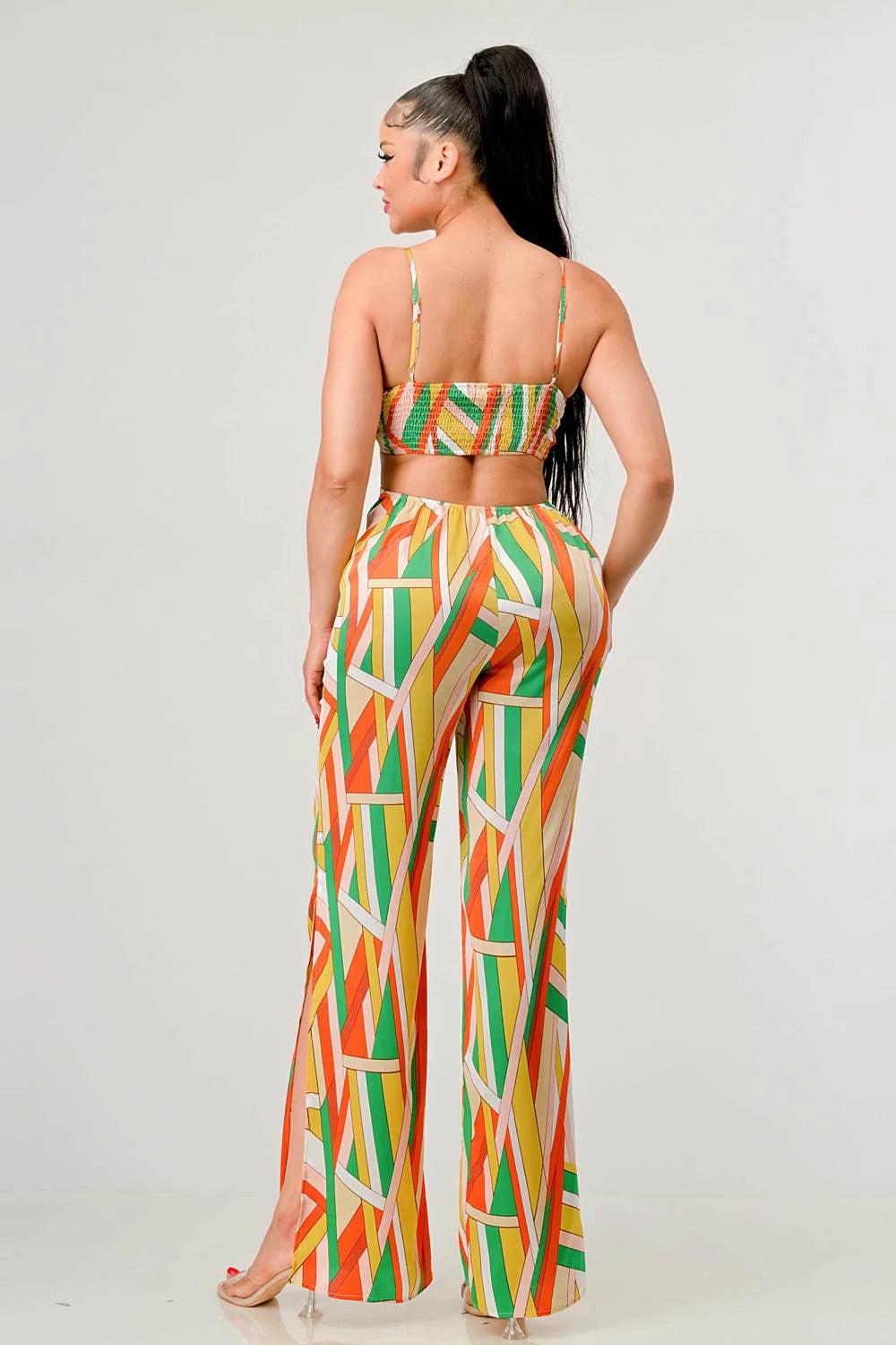 Woman wearing a Luxe Geo Print Satin Bra Top and Palazzo Jumpsuit in orange multi-color, back view showing geometric pattern.