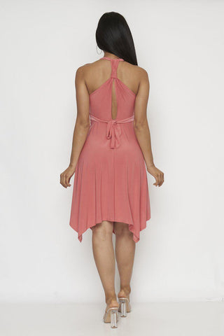 Woman wearing a stylish mauve mini dress with a halter neckline and tie-back detail, showcasing the elegant drape and flow of the fabric.