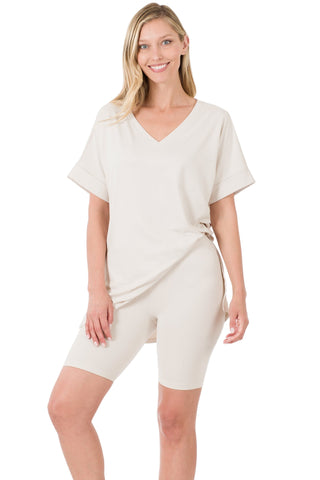Brushed microfiber V-neck top and biker shorts set in cream, featuring a hi-low hem and buttery soft fabric with perfect stretch.
