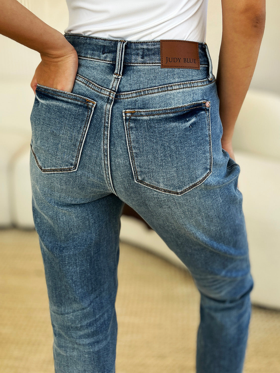 Mid Rise Rigid Magic Release Hem Jeans with back view, showcasing denim detail and moderate stretch fit for stylish comfort.