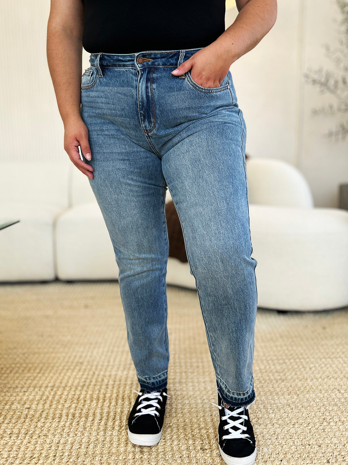 Mid Rise Rigid Magic Release Hem Jeans with moderate stretch, featuring front and back cotton panels for style and comfort.