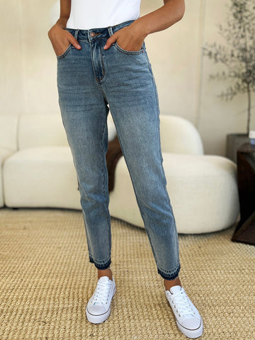 Mid Rise Rigid Magic Release Hem Jeans with moderate stretch, cotton blend, casual style, full size fit, front and back panel detail.
