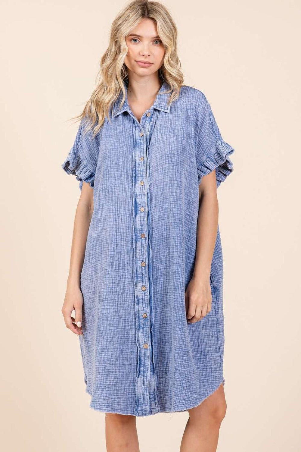 Mineral wash cotton gauze mini shirt dress with buttoned front, ruffled sleeves, and raw hem, 100% cotton.