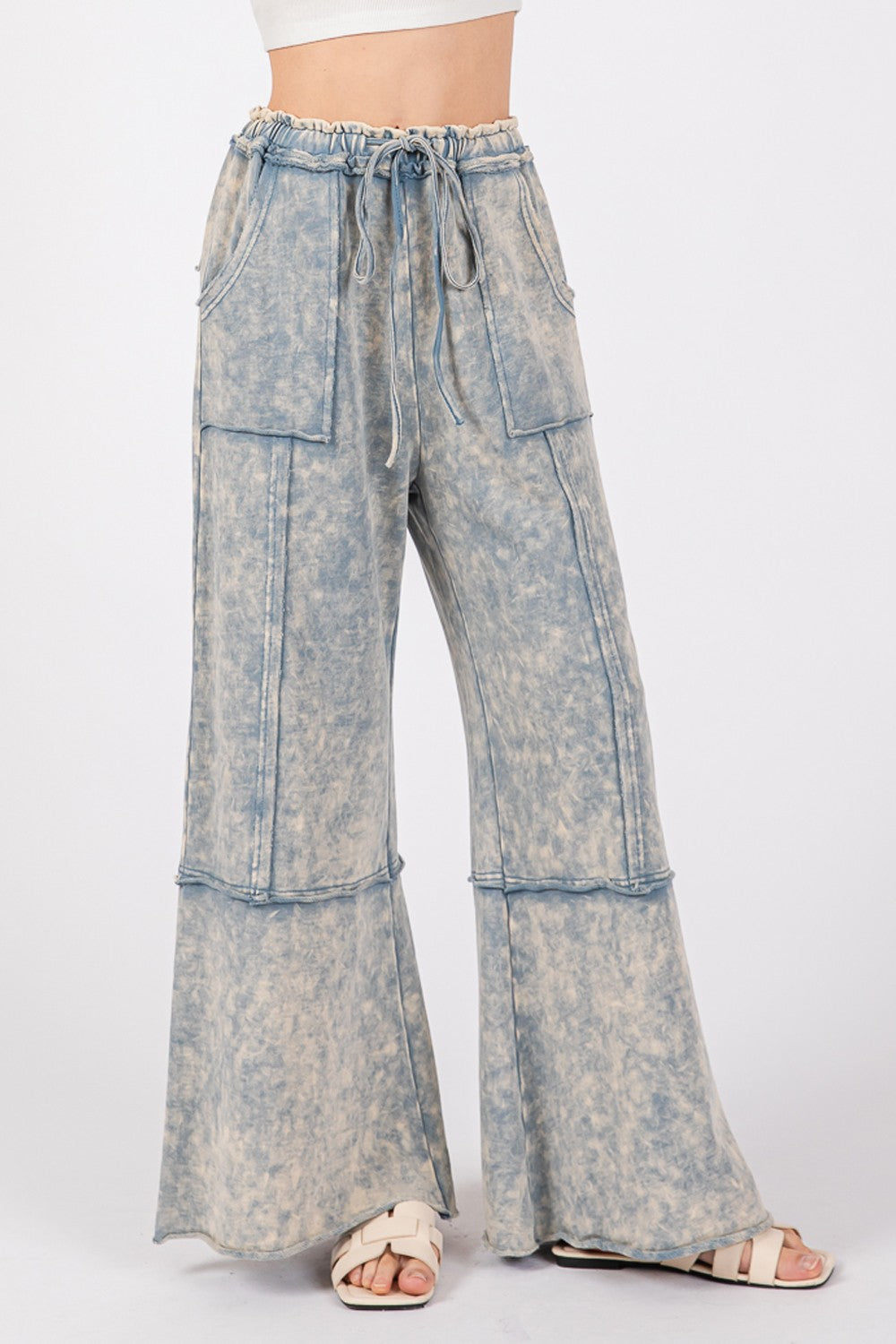 Mineral washed slate blue wide leg terry pants with elastic waistband and pockets.